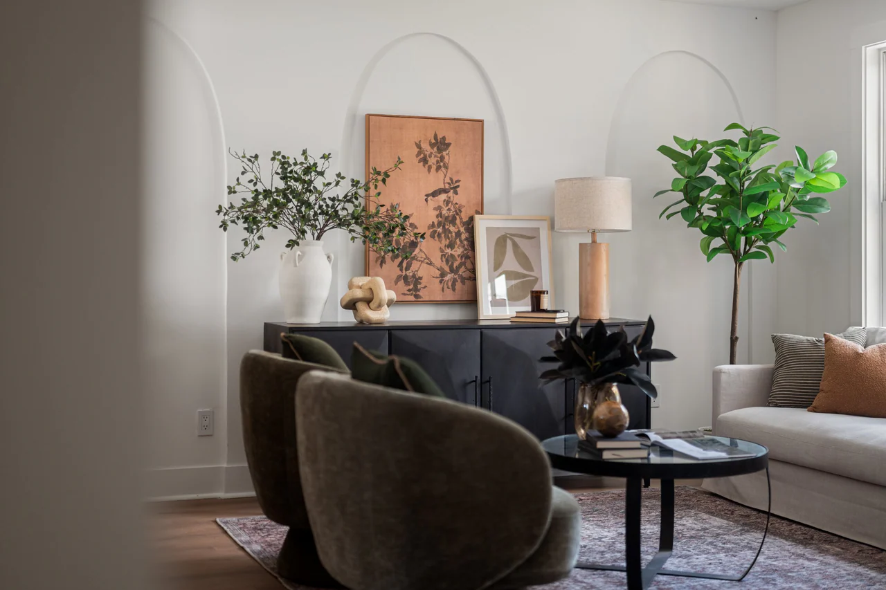 Sideboard and sofa seen past a swivel chair